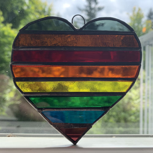 Stained Glass Pride Rainbow Heart with Black and Brown Stripes by Infinity Glassworks